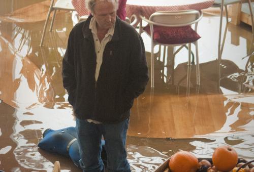Tim Smit and Gayor Coley looking at flooding inside an Eden Project building